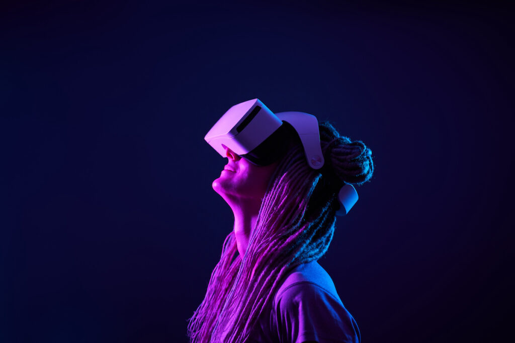 Woman is using virtual reality headset.